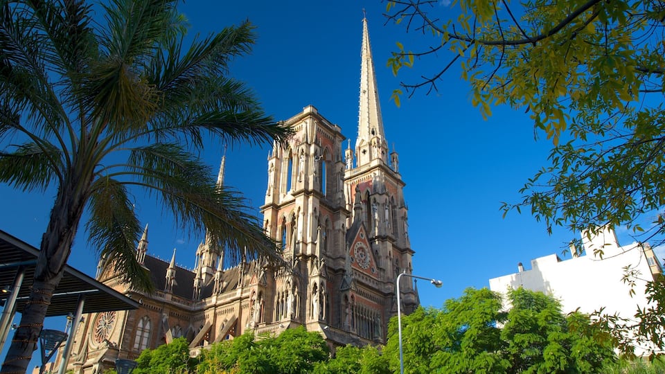 A historic cathedral with intricate architecture, including a tall spire and detailed stonework.