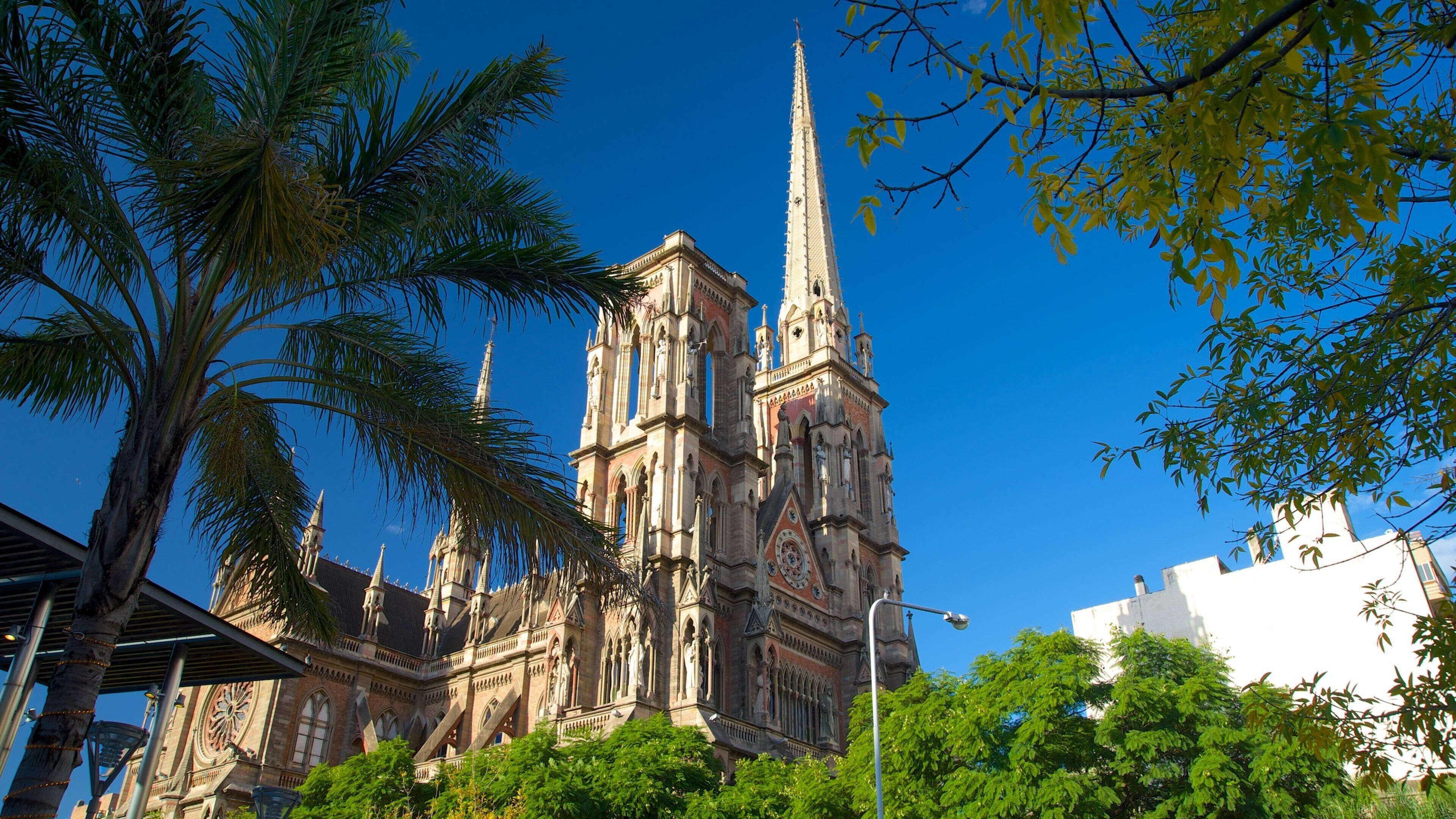 A historic cathedral with intricate architecture, including a tall spire and detailed stonework.
