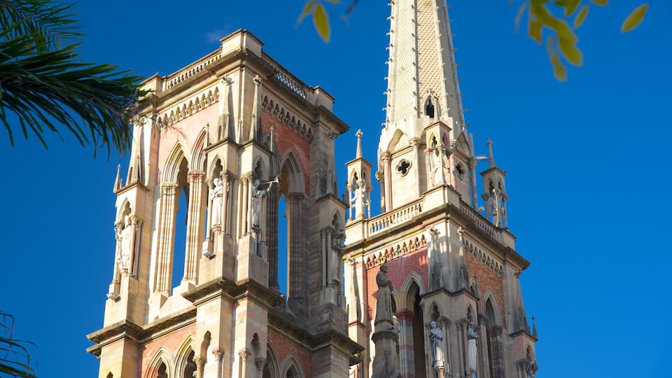 A historic cathedral with intricate Gothic architecture, including pointed arches and detailed stone carvings.