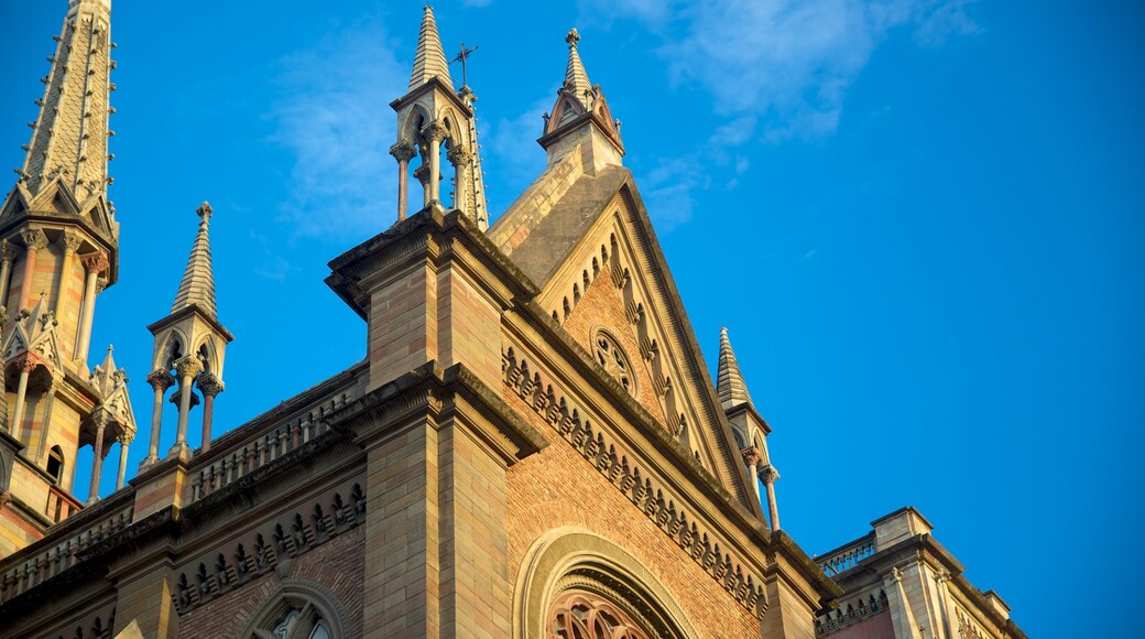 Sagrado Corazon Church featuring a sunset, a church or cathedral and heritage architecture