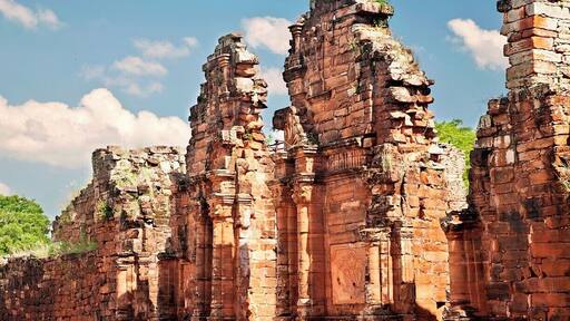 The impressive gateway of the church stands as testament to the power the Jesuit missions held over the local populations. This red sandstone gateway once stood 30ft tall (10m) as it welcomed the native Christian population into it's cavernous interior.
San Ignacio Mini was a Jesuit mission established in 1610 with the aim of converting the local Guaraní natives. The mission moved to this location in 1666 and a large complex was erected to house and protect up to 4000 converts. The complex was built in Spanish baroque style around a central courtyard and included a large church, school, hospital, cemetery, dormitories and workshops.
The mission was largely abandoned when the Jesuits were expelled by Spanish decree in 1767, and was then destroyed by Paraguayan decree some 50 years later. The remains of the mission were rediscovered in 1897 and are now listed as a UNESCO World Heritage Site.