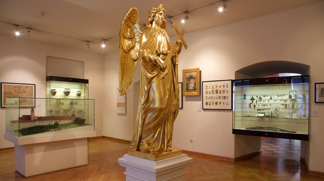 Zagreb City Museum featuring a statue or sculpture, religious elements and interior views
