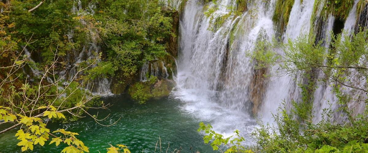 Plitvice Lakes National Park - Entrance 1 featuring a cascade and a lake or waterhole