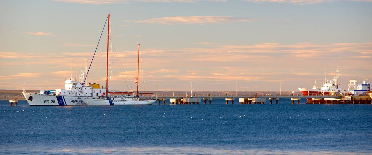 Puerto Madryn Beach featuring a sunset and general coastal views