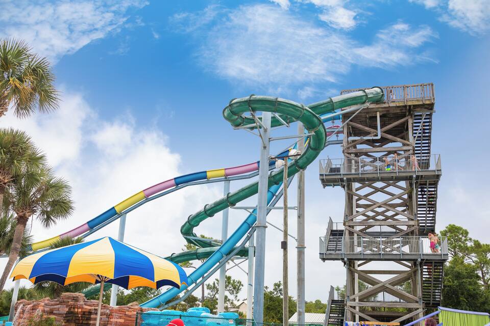 A water park with a multi-lane water slide and a tall observation tower.