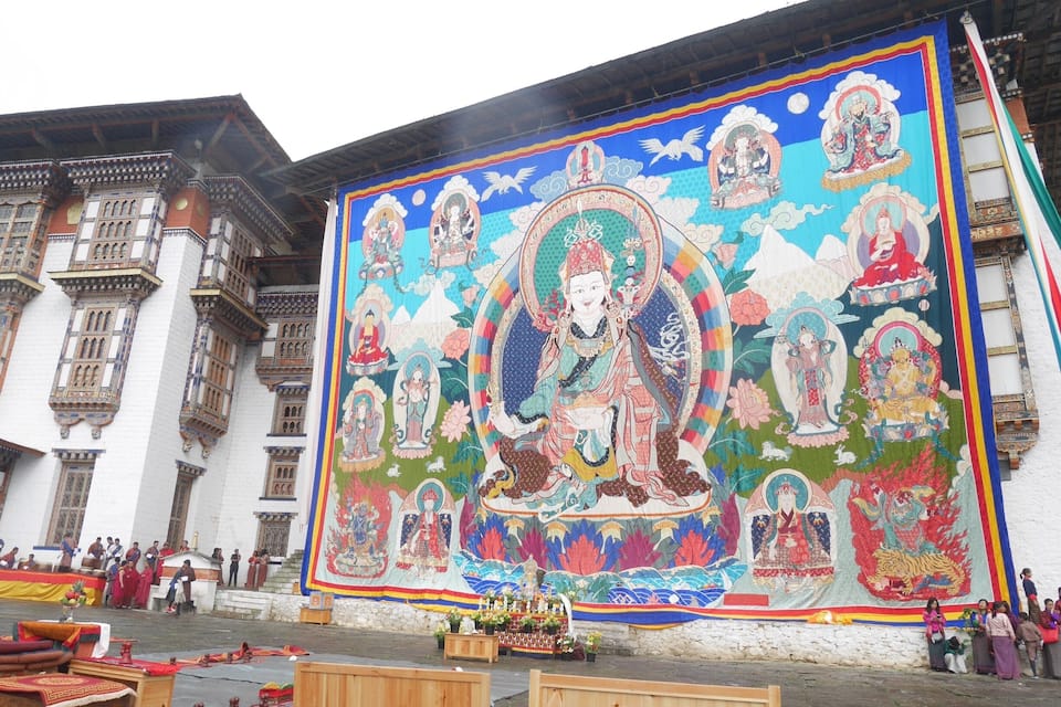A large mural with religious figures on a building.