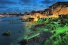 Evening view of Old Town of Sozopol (former ancient town of Apollonia) with Southern Fortress Wall and Tower in the yellow-green illumination, Bulgaria