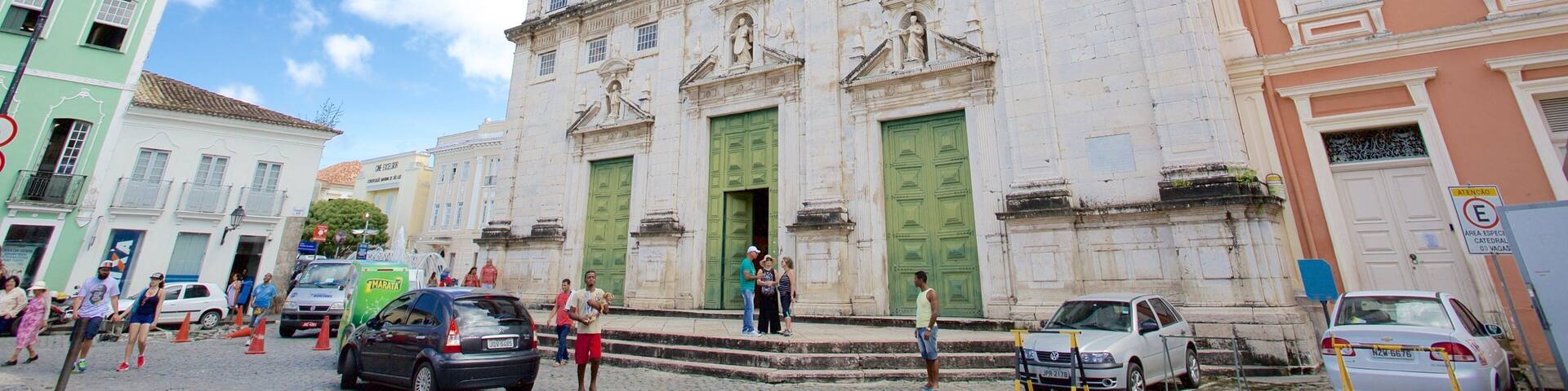 A historic building with green doors and classical architecture.