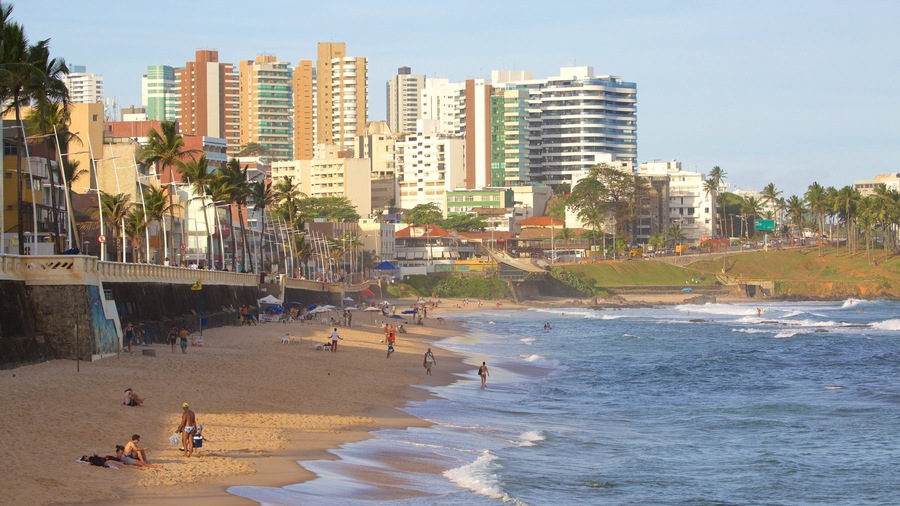 Farol da Barra Beach showing a coastal town, skyline and a sandy beach