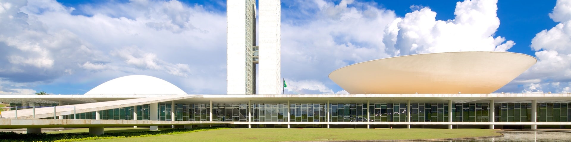 National Congress of Brazil showing a city, modern architecture and a pond