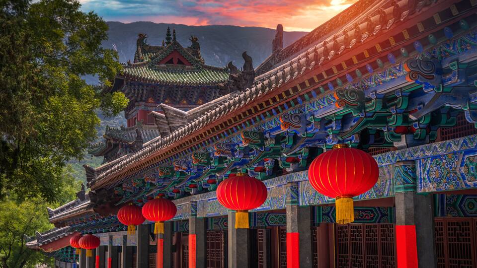 Traditional Chinese architecture with ornate details and red lanterns.