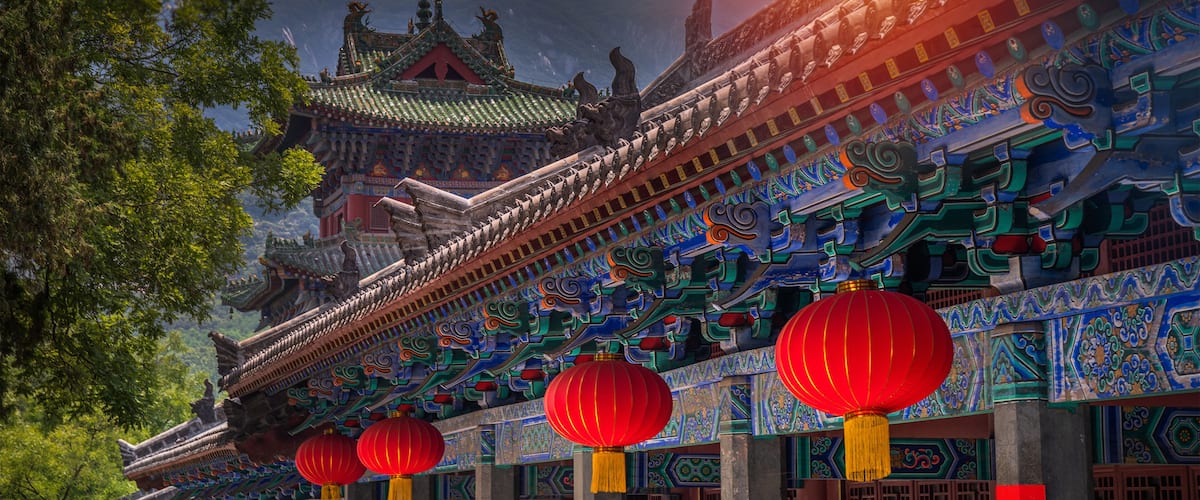 Traditional Chinese architecture with ornate details and red lanterns.