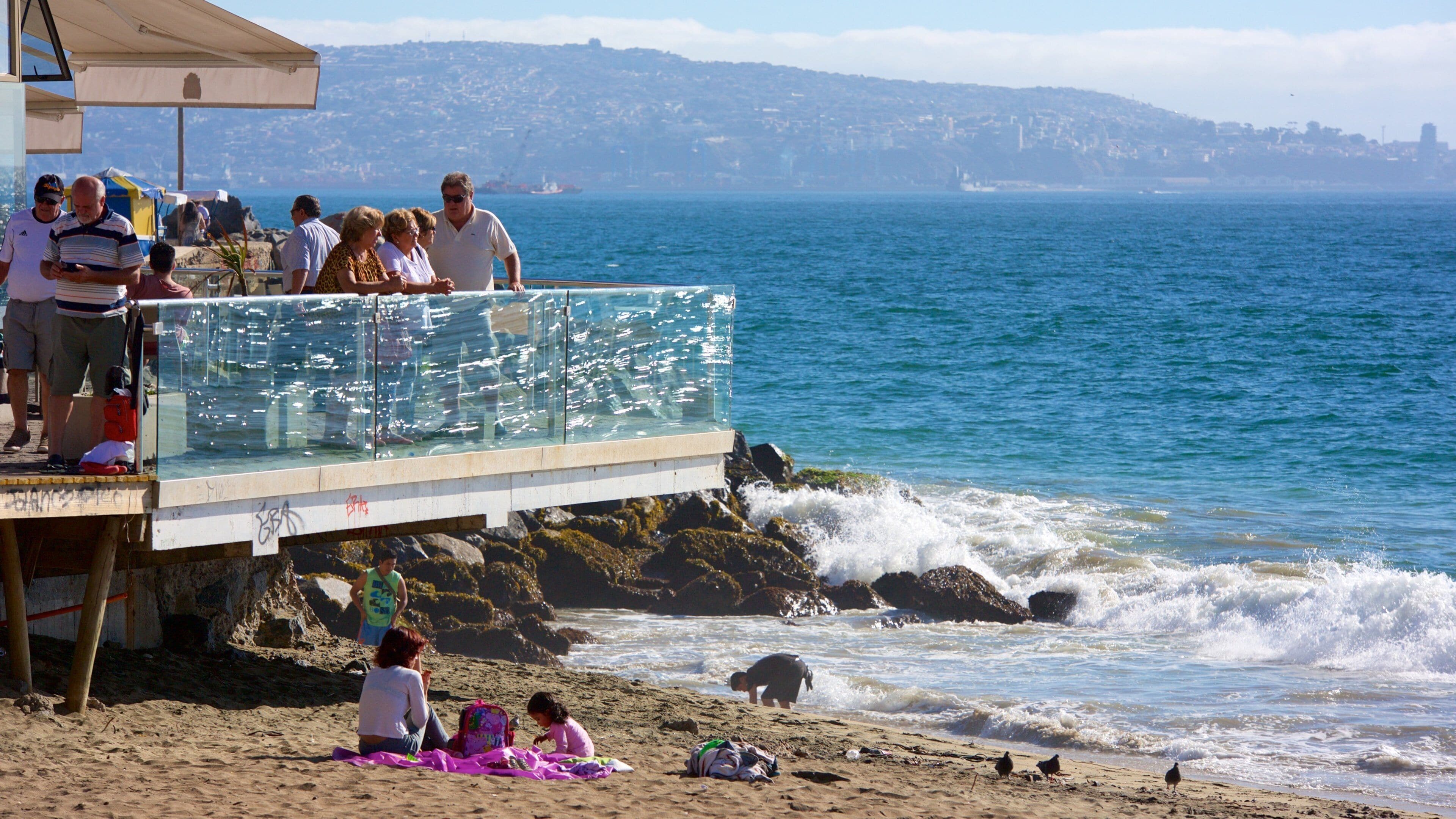 Acapulco Beach featuring a beach as well as a small group of people