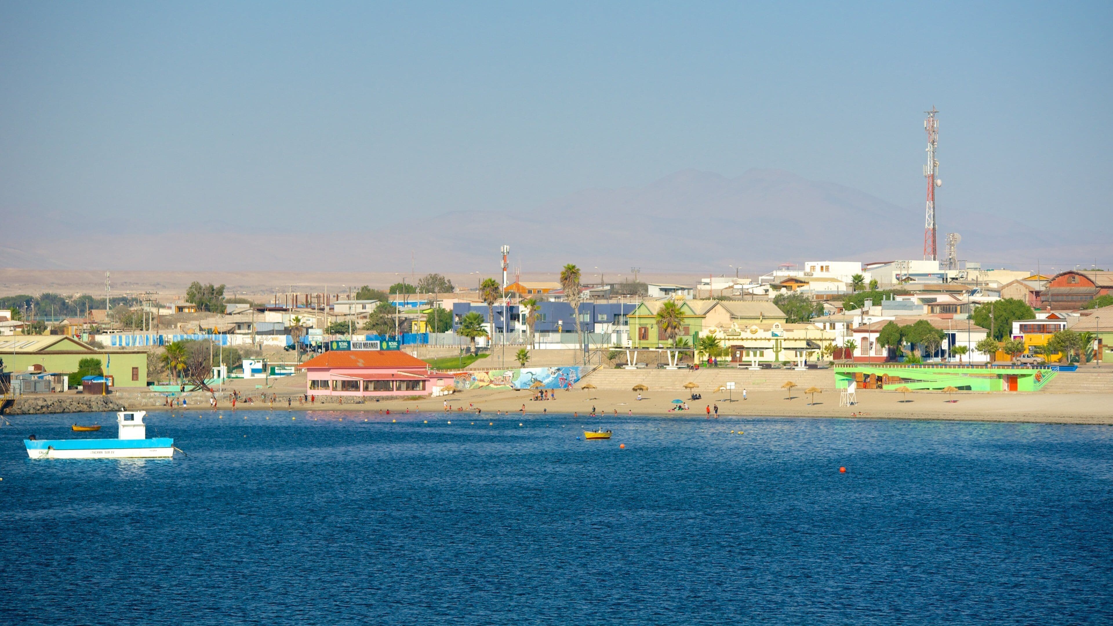 Caldera Beach featuring a coastal town and a beach