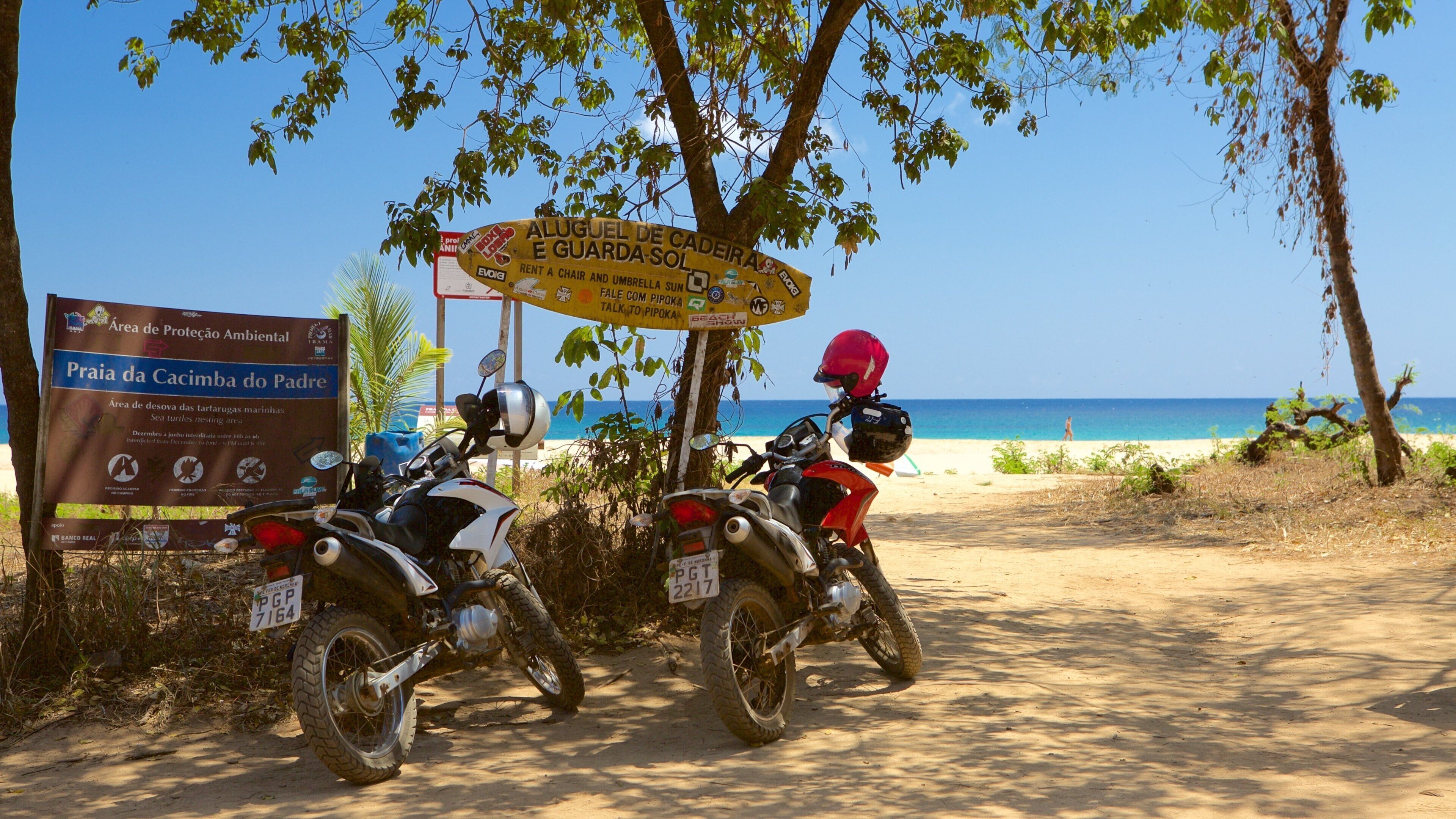 Cacimba do Padre Beach which includes a beach, motorcycle riding and signage