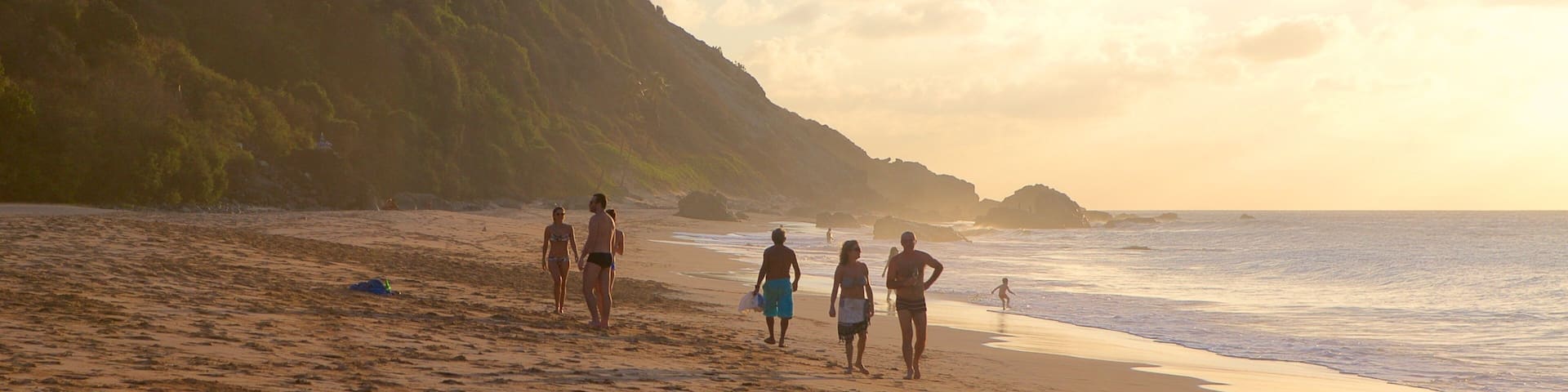 Conceicao Beach which includes general coastal views, a sandy beach and a sunset