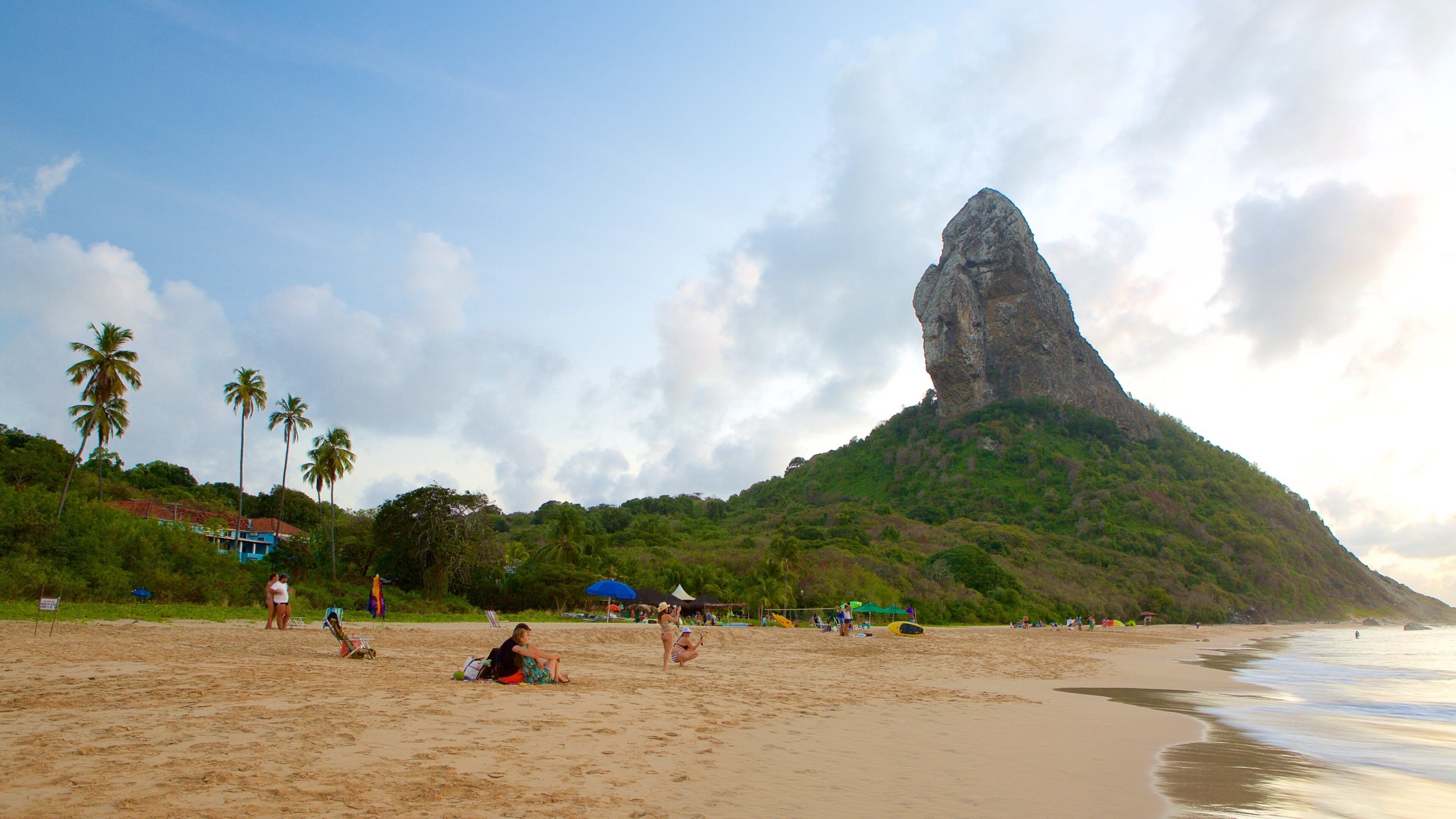 Conceicao Beach which includes mountains, tropical scenes and a sandy beach