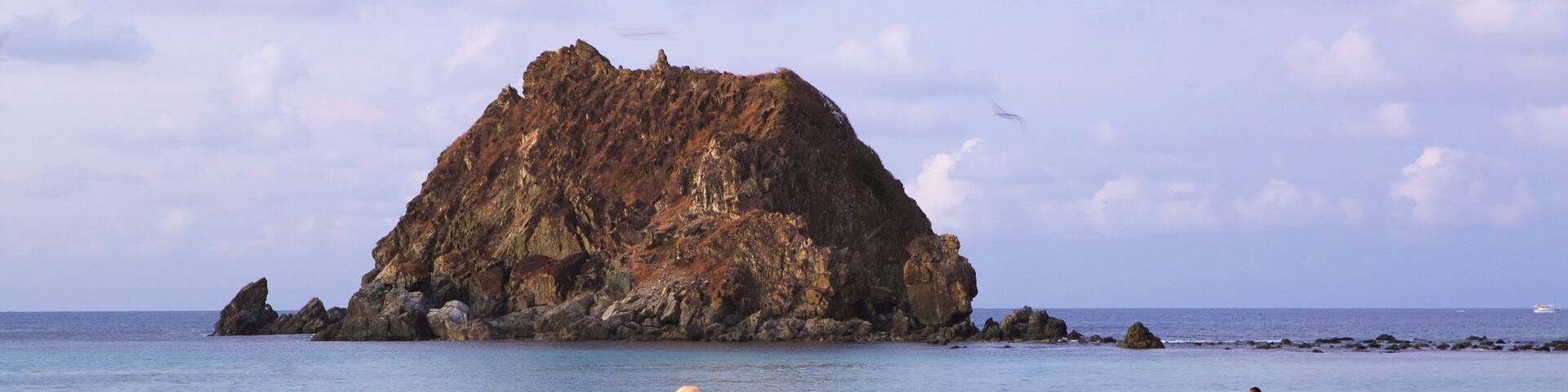 Conceicao Beach showing a sandy beach and general coastal views as well as a small group of people