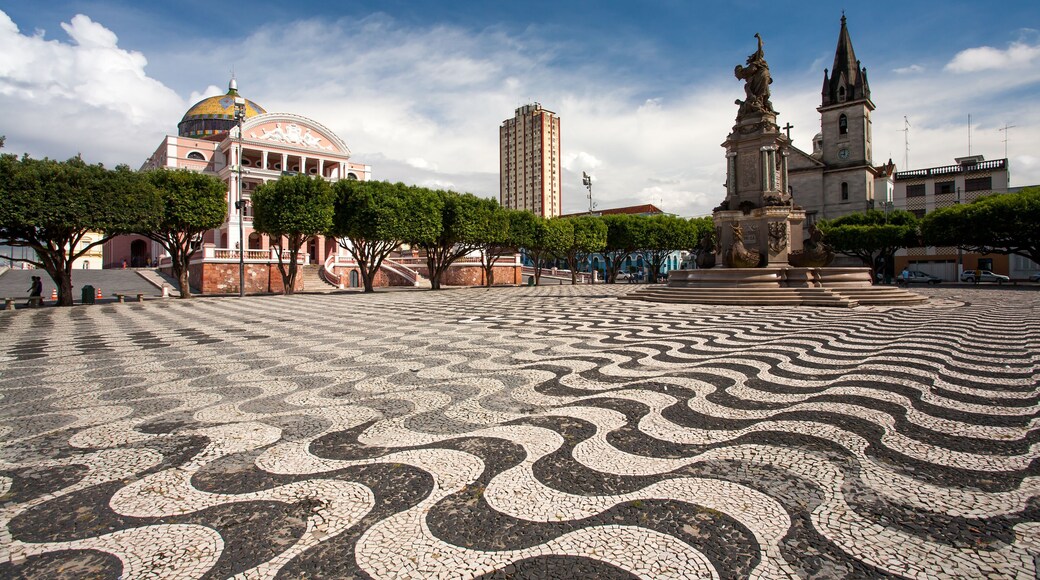 Manaus city sidewalk with Amazon theatre and church
