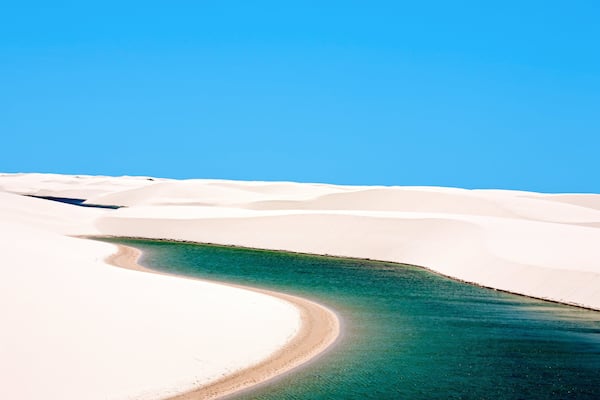 View of lagoa azul in desert white sand dunes of the Lencois Maranheses National Park in brazil