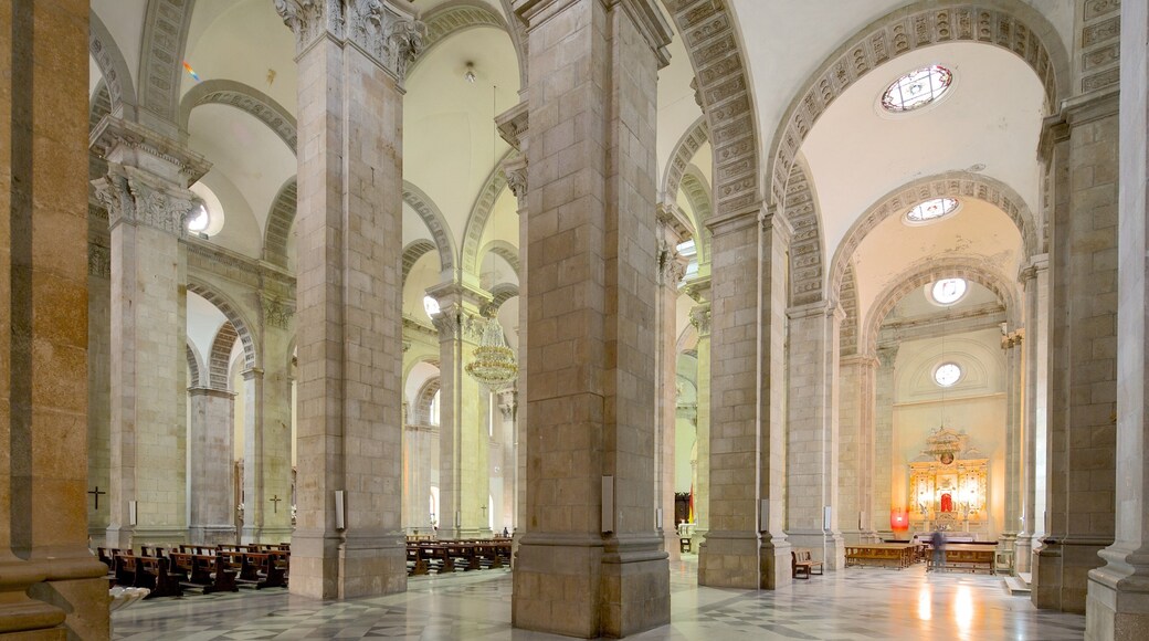 Plaza Murillo featuring religious elements, interior views and heritage architecture