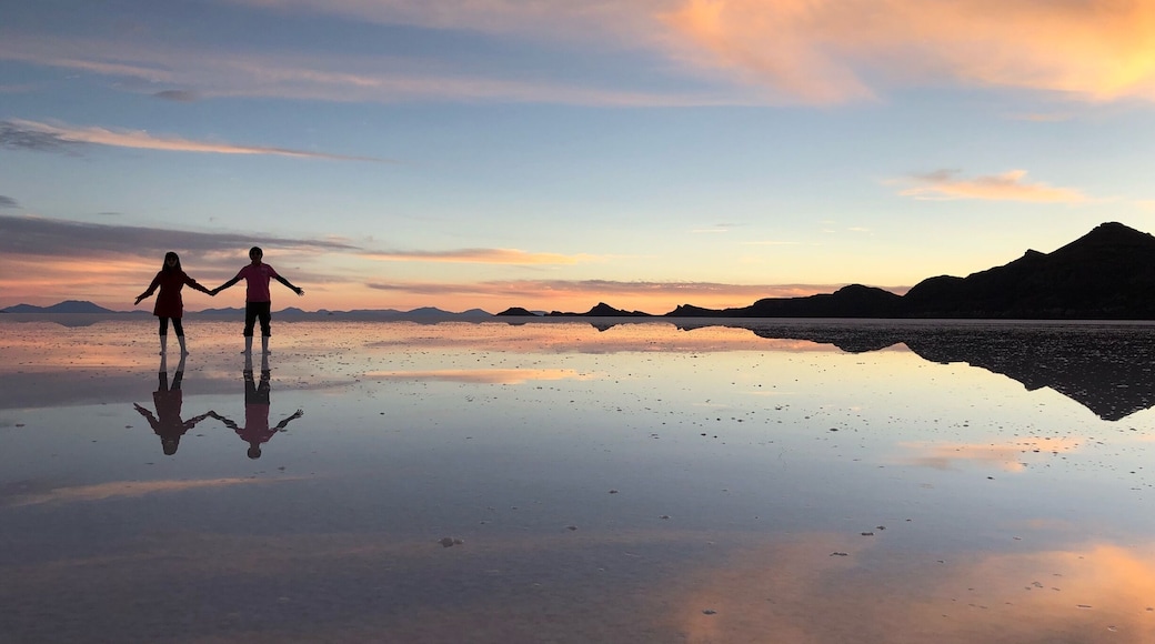 Enjoying sunset and the perfect reflection in Uyuni salt flat