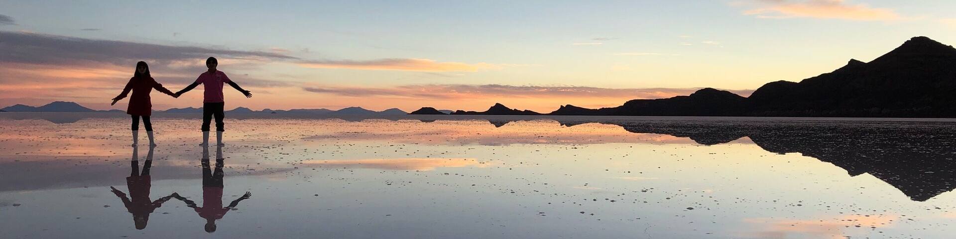 Enjoying sunset and the perfect reflection in Uyuni salt flat