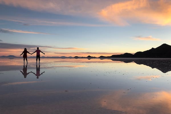 Enjoying sunset and the perfect reflection in Uyuni salt flat