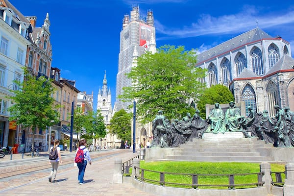 Saint Bavo Cathedral showing a statue or sculpture and a city