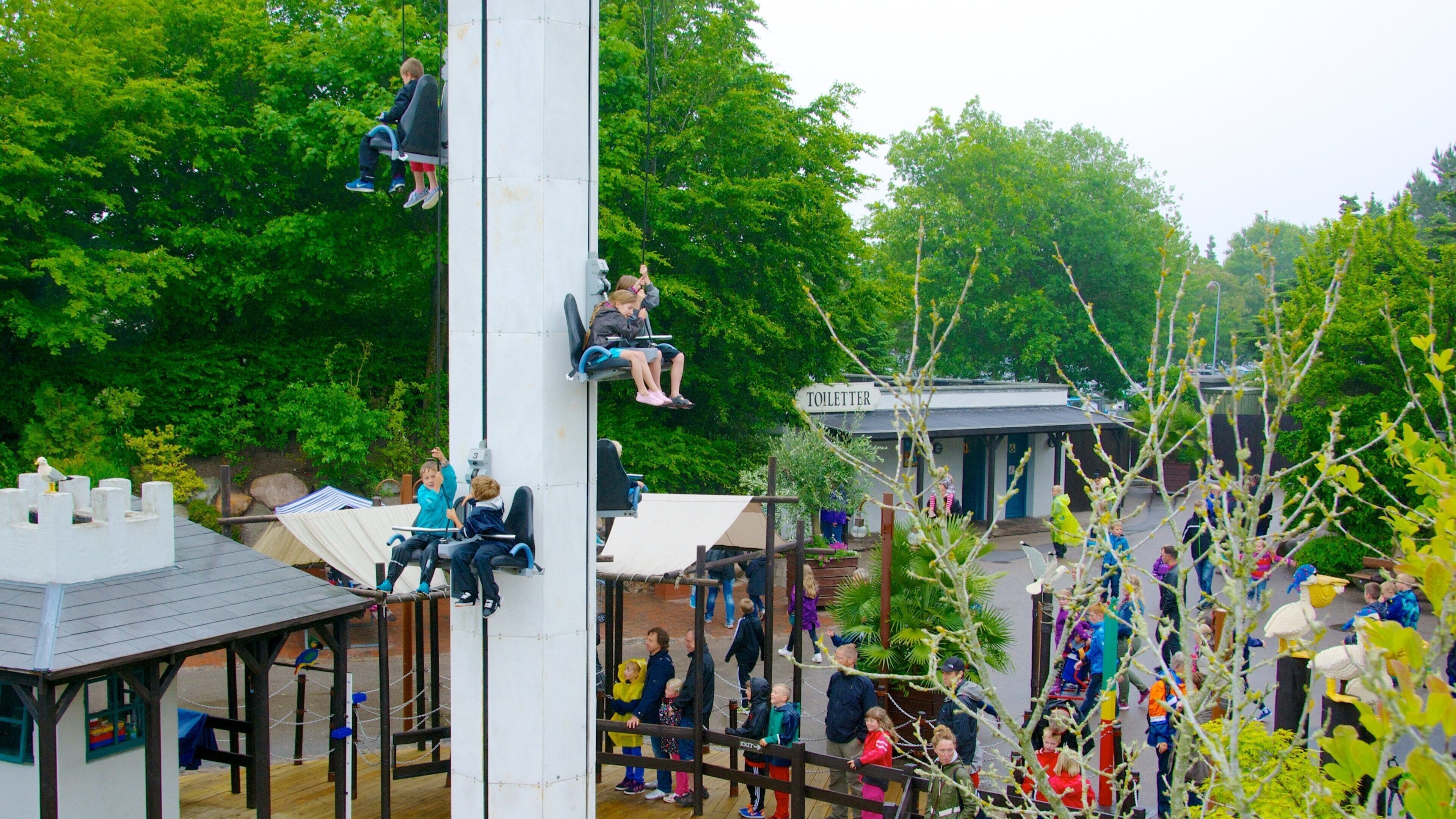 Legoland Park featuring rides as well as a large group of people