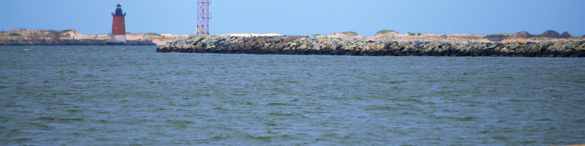 Lewes Beach featuring a lighthouse, general coastal views and a beach