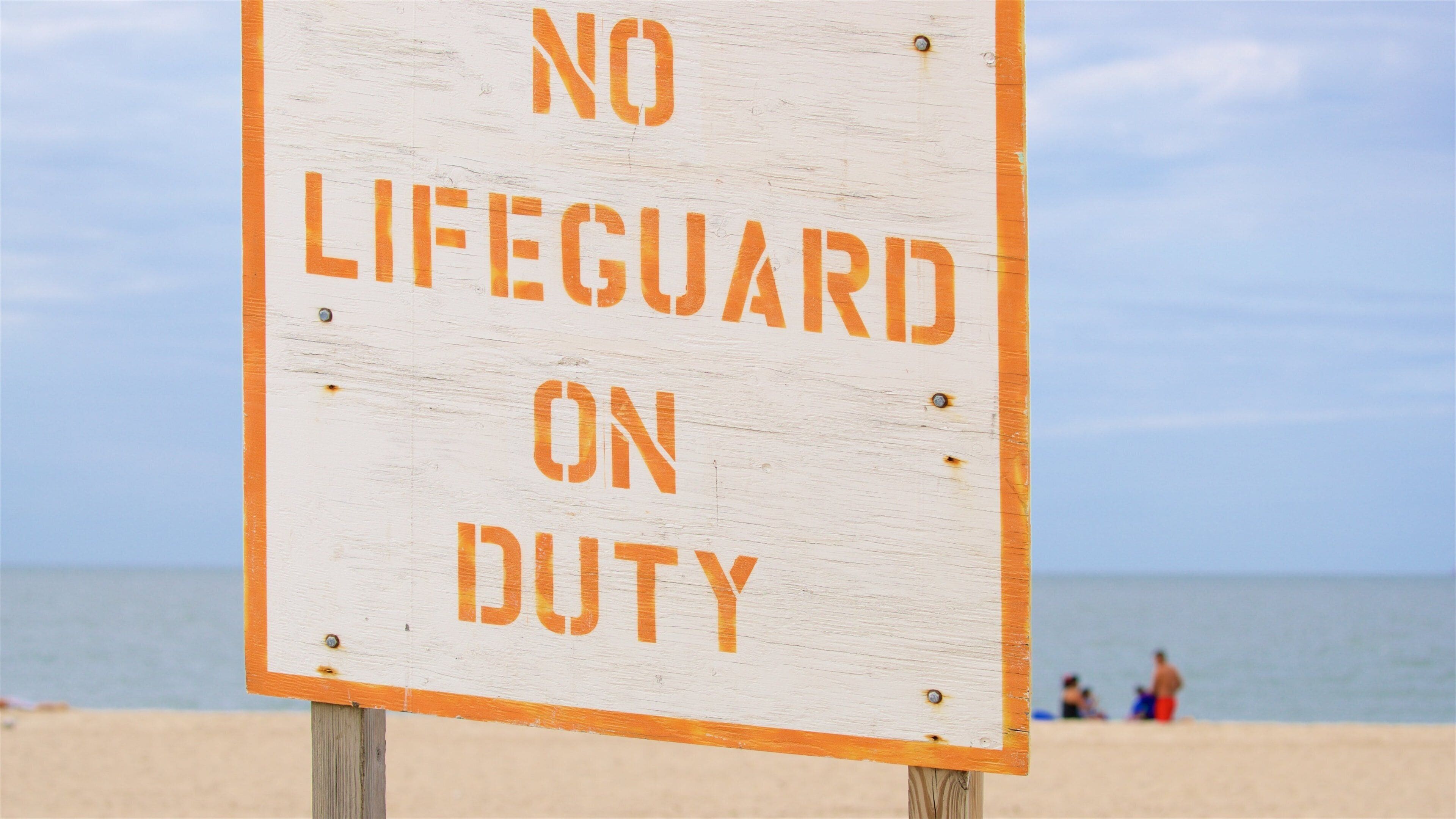Lewes Beach som visar en strand, skyltar och kustutsikter