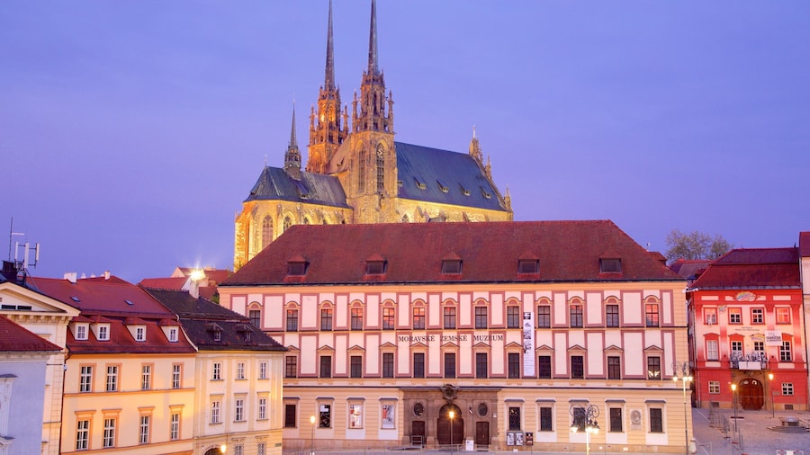 Cathedral of St. Peter and St. Paul showing a sunset and a city