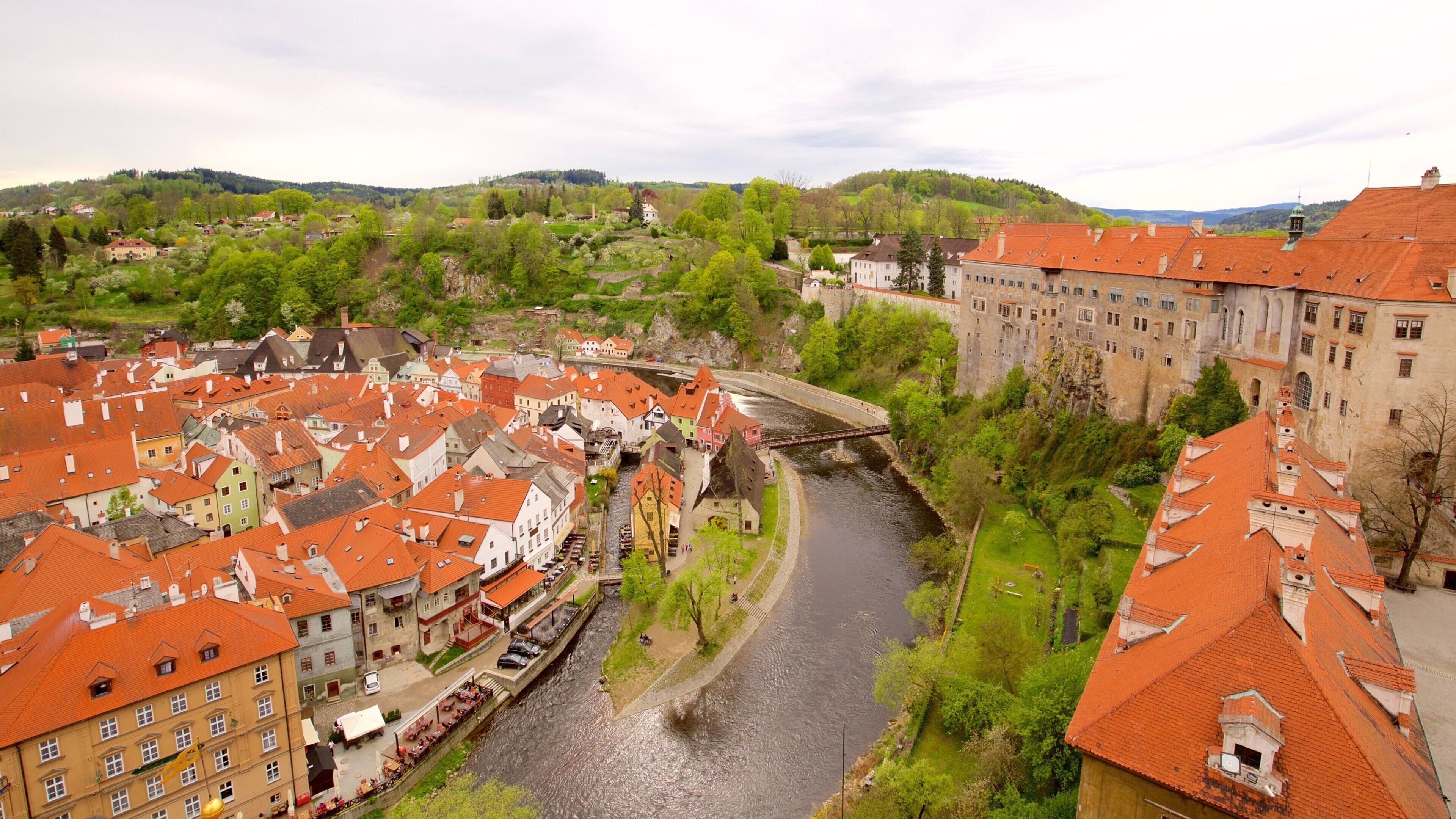 Cesky Krumlov Castle which includes a city and a river or creek