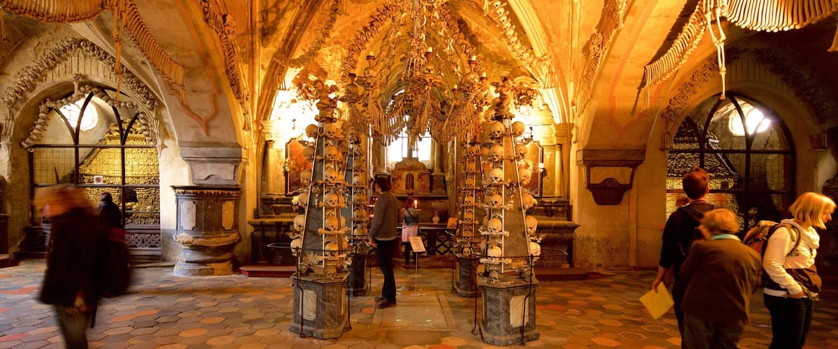 Sedlec Ossuary showing interior views and heritage elements as well as a small group of people