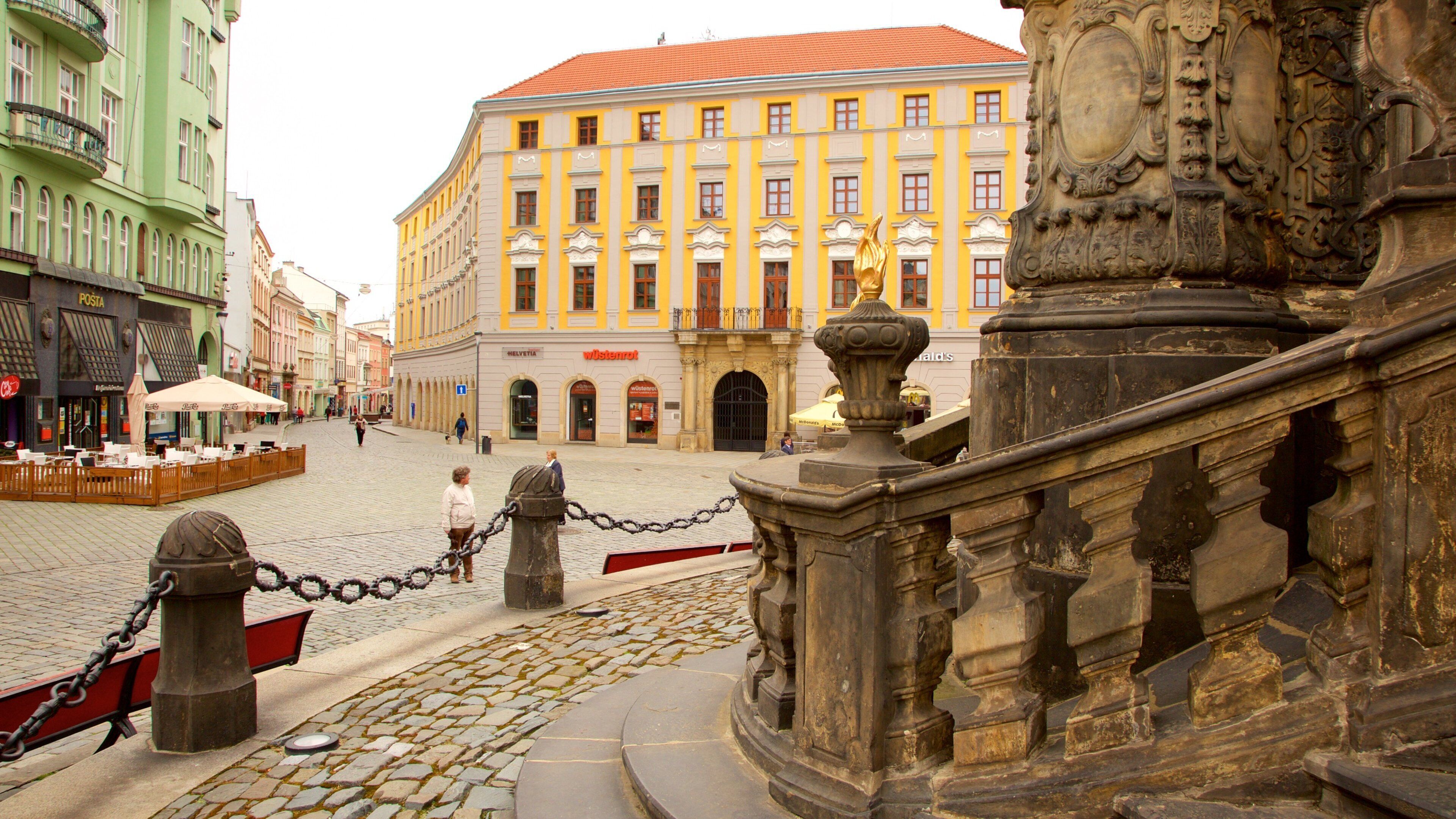 Holy Trinity Column which includes a statue or sculpture, heritage elements and a square or plaza