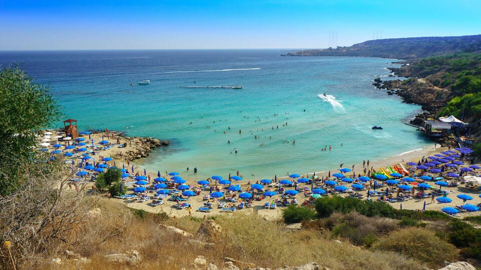 People at the famous beach of Konnos Bay Beach, Ayia Napa. Famagusta District, Cyprus. Best beaches of Cyprus - Konnos Bay in Cape Greko national park