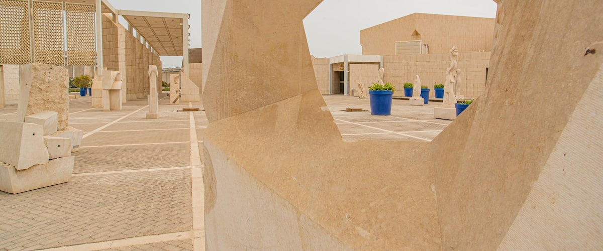 Bahrain National Museum featuring a statue or sculpture, heritage elements and a square or plaza