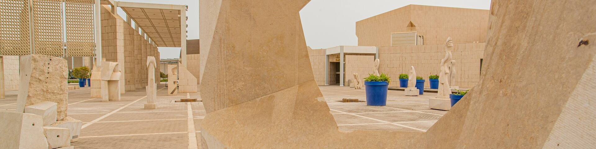 Bahrain National Museum featuring a statue or sculpture, heritage elements and a square or plaza