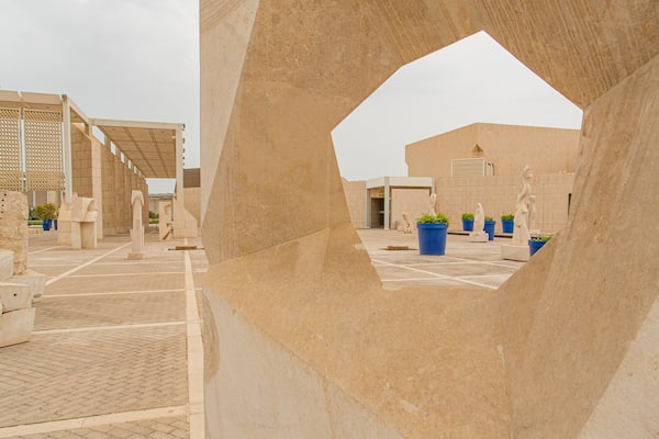 Bahrain National Museum featuring a statue or sculpture, heritage elements and a square or plaza