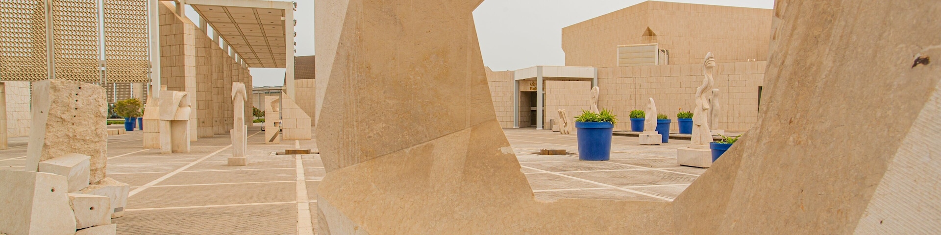 Bahrain National Museum featuring a statue or sculpture, heritage elements and a square or plaza