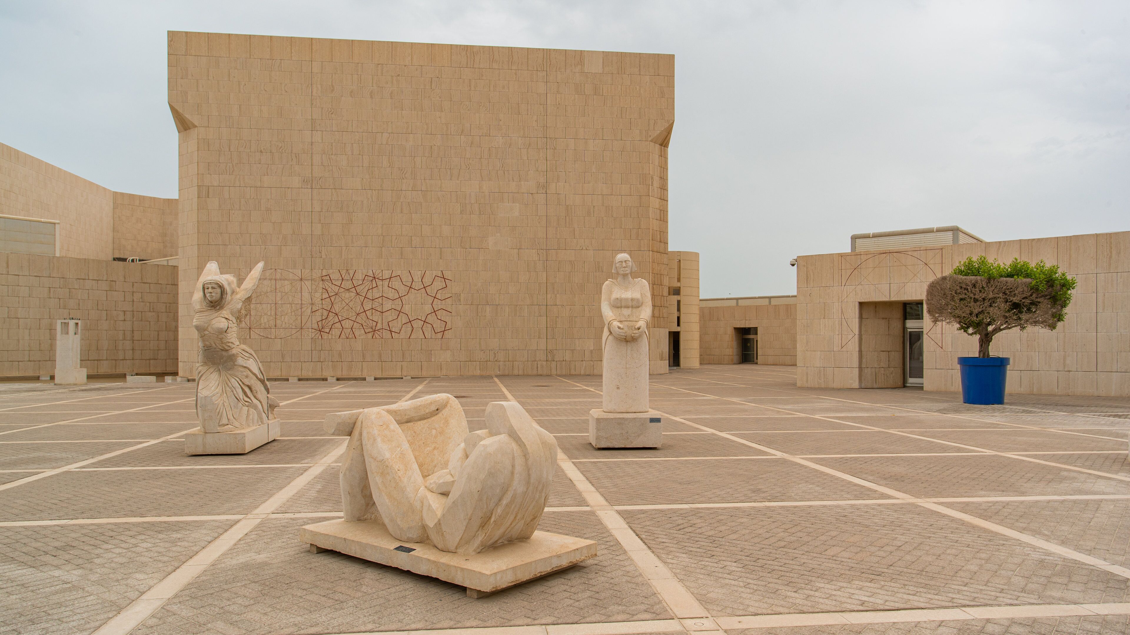 Bahrain National Museum which includes a statue or sculpture and a square or plaza