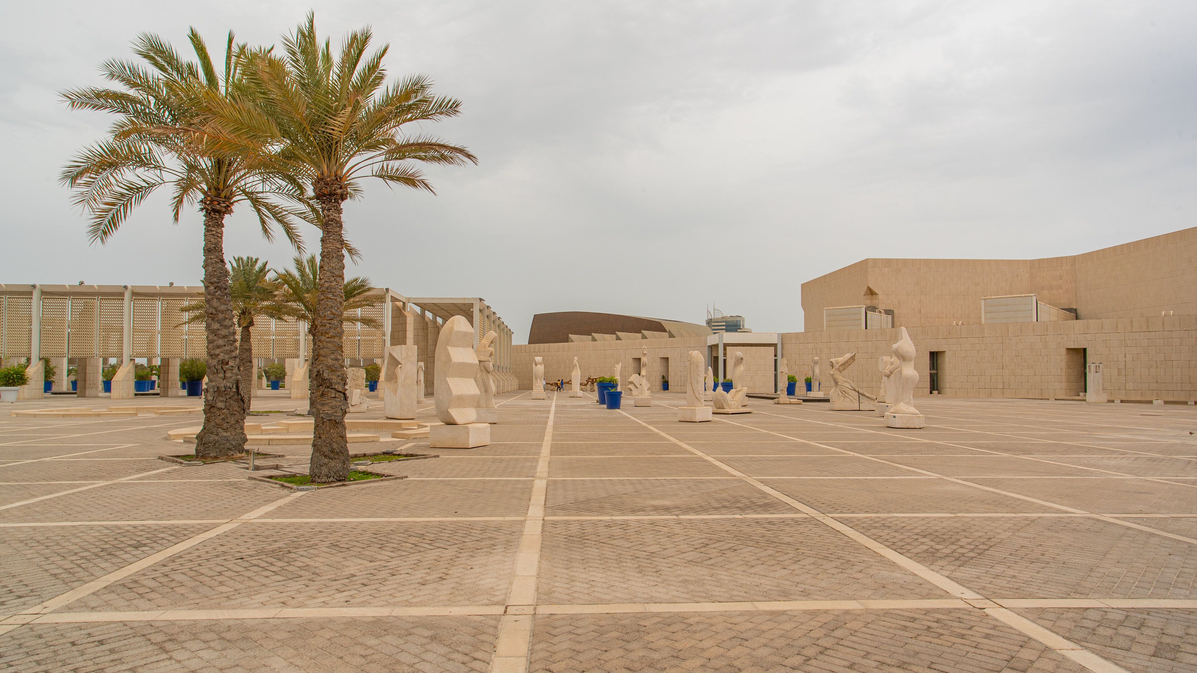 Bahrain National Museum showing a square or plaza and a statue or sculpture