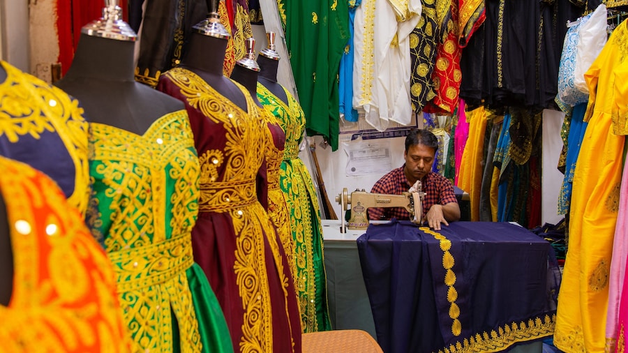 Bab Al Bahrain featuring shopping and markets as well as an individual male