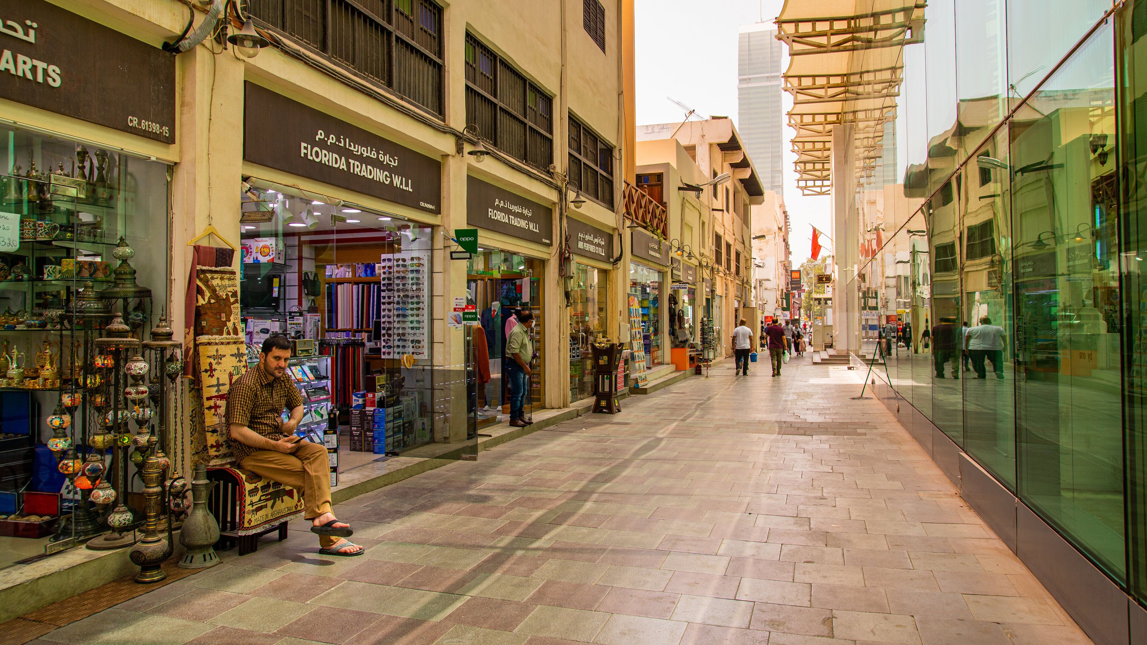Bab Al Bahrain featuring street scenes as well as an individual male