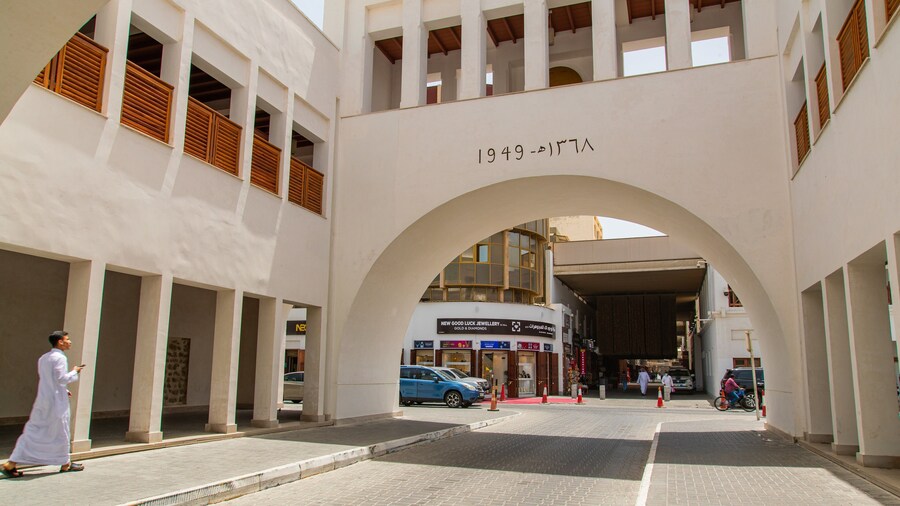 Bab Al Bahrain which includes street scenes and a city