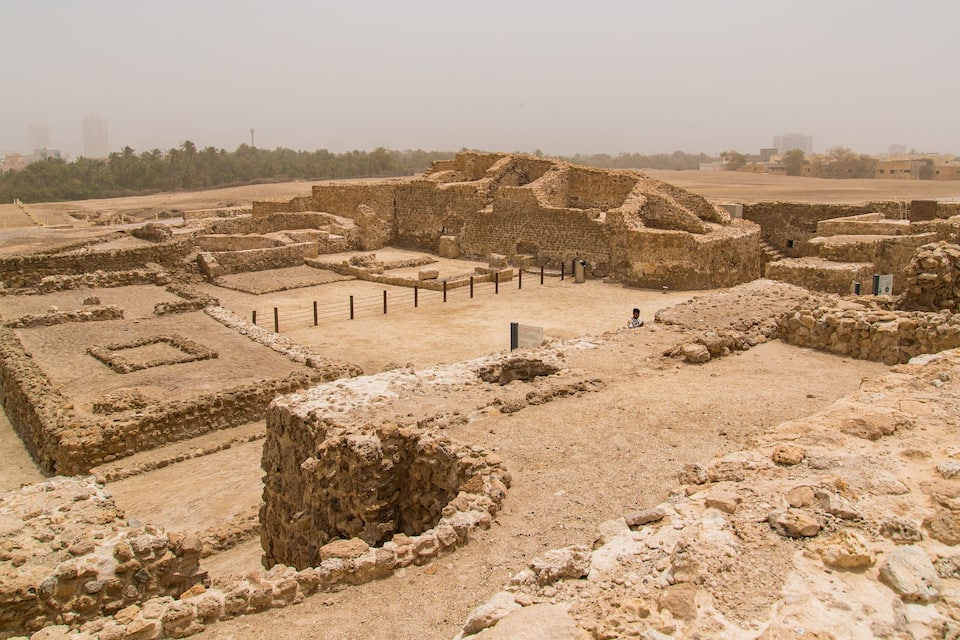 Ancient ruins with stone structures and pathways.