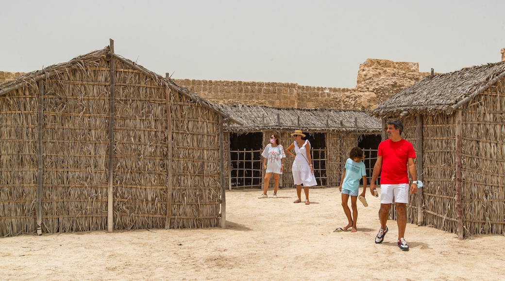 Qal\'at al-Bahrain Site and Museum which includes a small town or village as well as a family