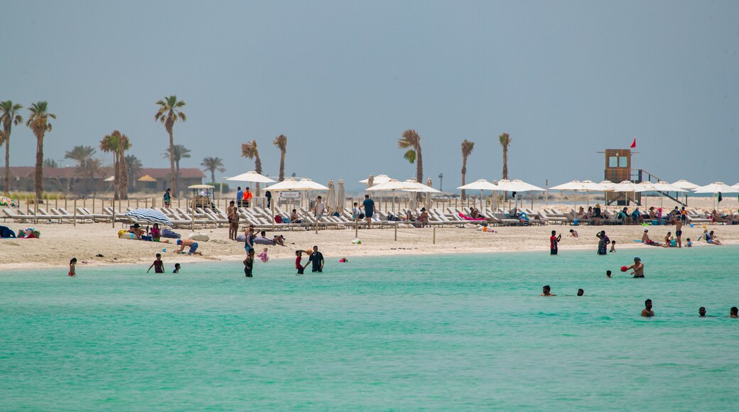 Al Jazaira Beach which includes a beach, general coastal views and swimming
