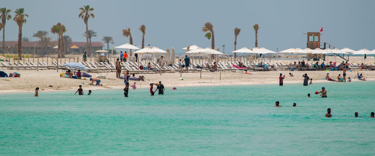 Al Jazaira Beach which includes a beach, general coastal views and swimming